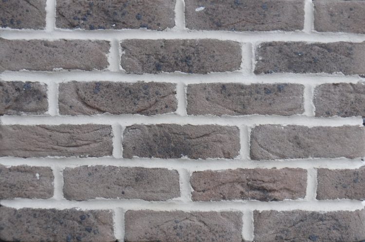 A picture of grey/brown brick slips with spotting. The product is called Crowborough Taupe