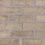 Cobalt Yellow brick slips pointed with grey coloured mortar.