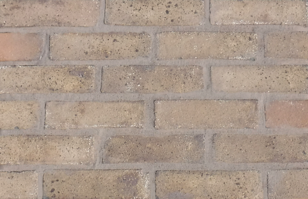 Cobalt Yellow brick slips pointed with grey coloured mortar.