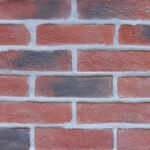 Kingston Antique brick slips pointed with grey coloured mortar.
