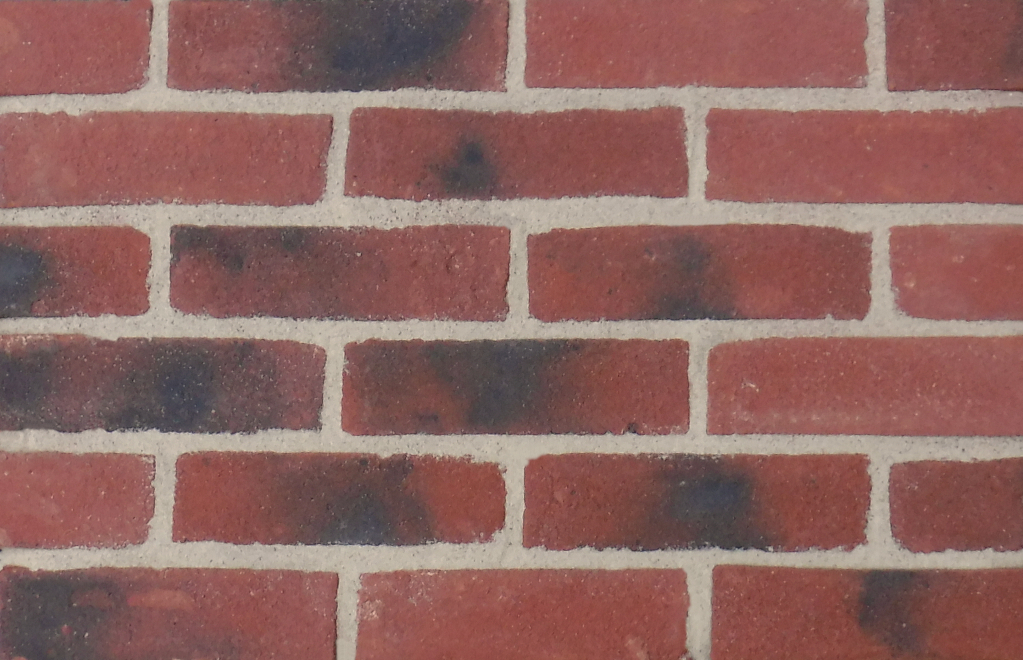 Kingston Antique brick slips pointed with light buff coloured mortar.