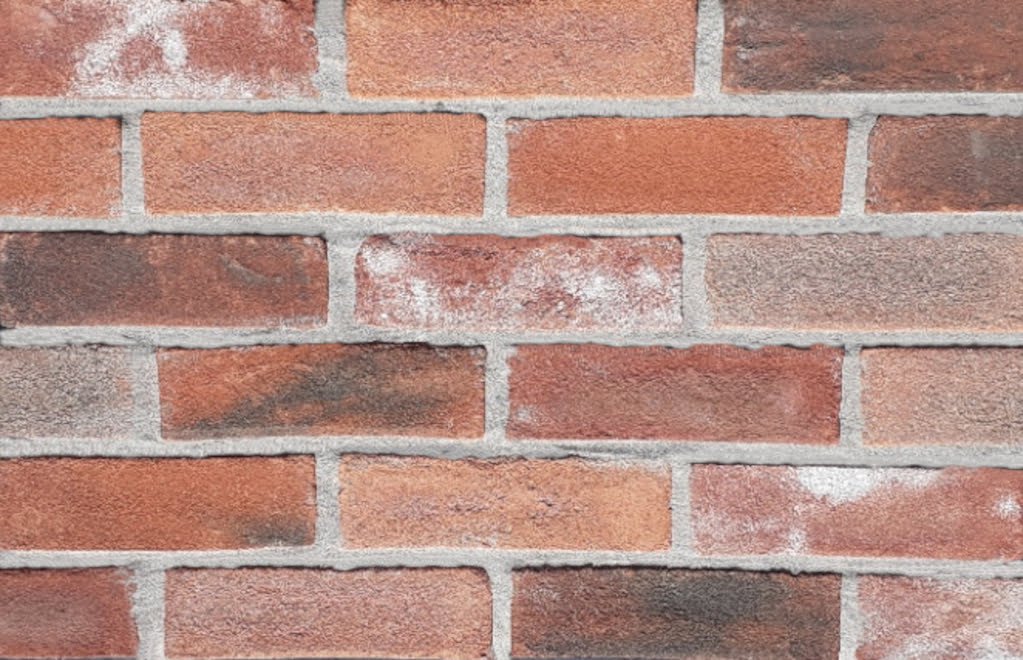 Brighton Blend brick slips pointed with light coloured mortar.