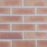 Capital Buff brick slips pointed with light coloured mortar.