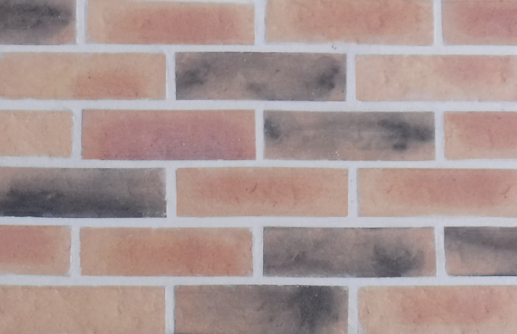 Epsom Buff Multi brick slips pointed with light coloured mortar.