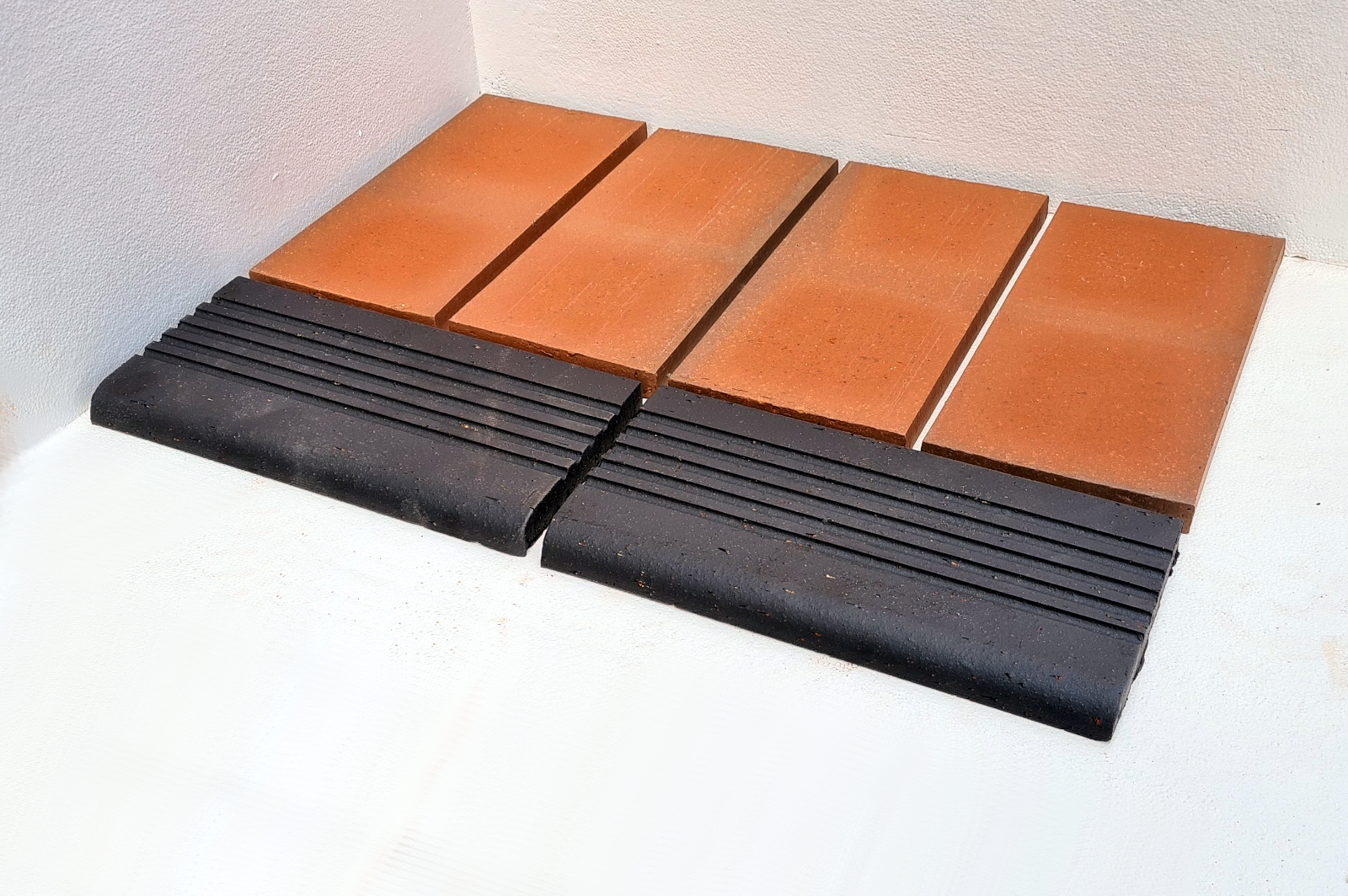 Black Steaptread quarry tiles laid near flame quarry tiles